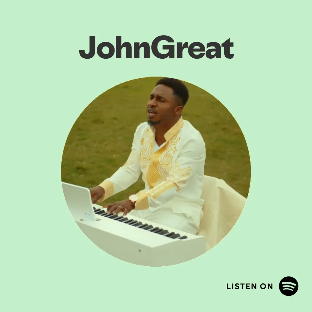 John Great singing while playing the keyboard